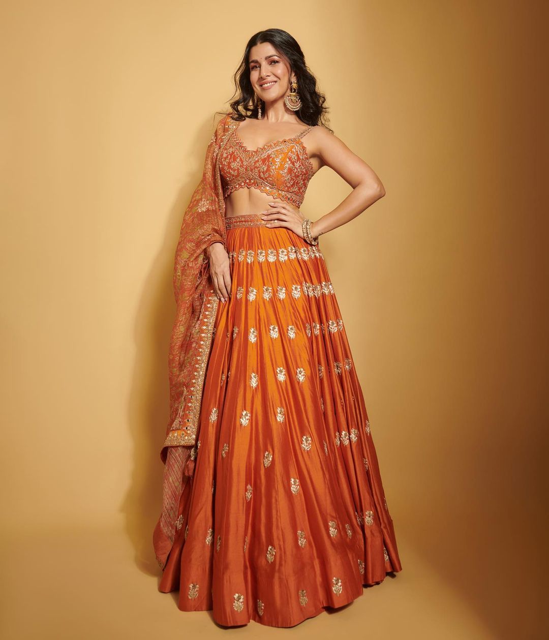 Bollywood Actress Nimrat Kaur Stills In Orange Lehenga Choli